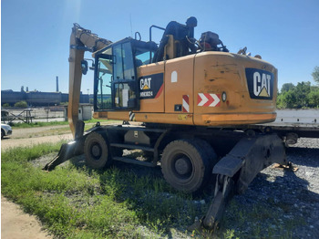 Колёсный экскаватор CATERPILLAR MH3024