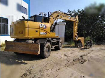 Колёсный экскаватор CATERPILLAR M315
