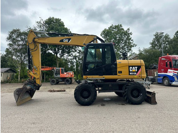 Колёсный экскаватор CATERPILLAR M313D