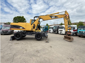 Колёсный экскаватор CAT M 322C: фото 3