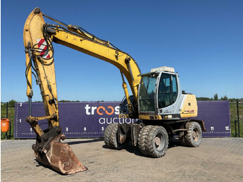 Колёсный экскаватор NEW HOLLAND