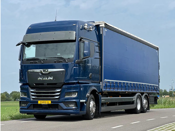 Тентованный грузовик MAN TGX 26.400
