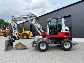 Колёсный экскаватор TAKEUCHI