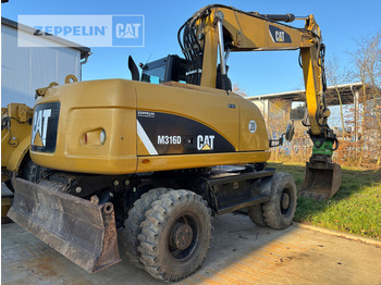 Колёсный экскаватор CATERPILLAR M316D