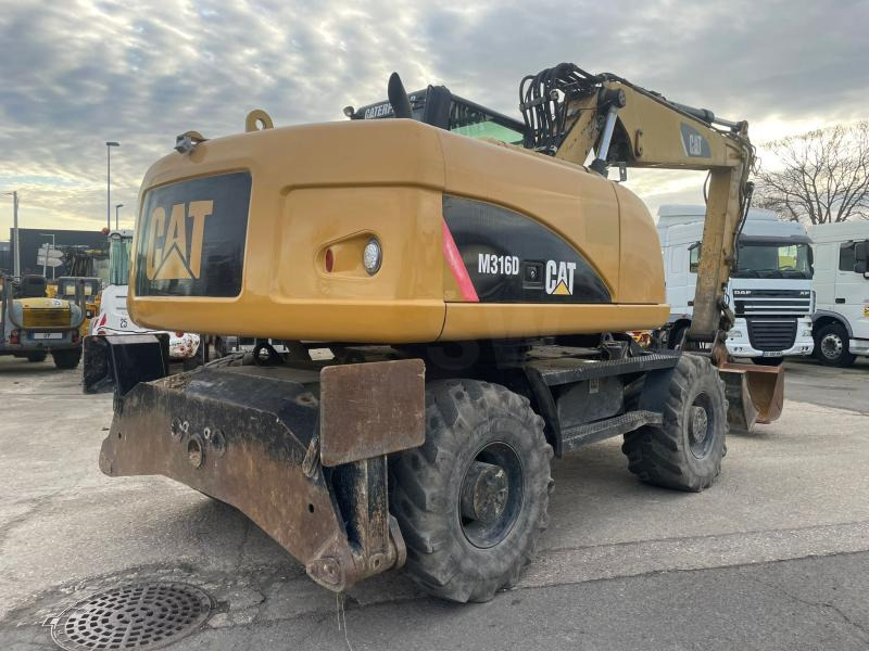 Caterpillar M316 - Колёсный экскаватор: фото 4 Caterpillar M316 - Колёсный экскаватор: фото 4