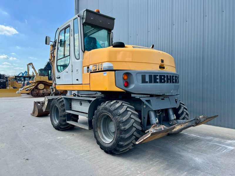 Liebherr A311 Litronic - Колёсный экскаватор: фото 2 Liebherr A311 Litronic - Колёсный экскаватор: фото 2