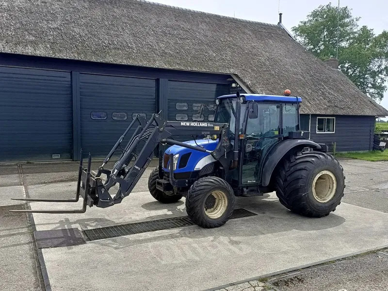 New Holland TN60DA TN60D met voorlader 520TL en vork - Трактор: фото 1 New Holland TN60DA TN60D met voorlader 520TL en vork - Трактор: фото 1