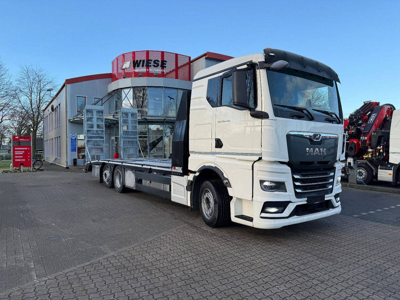 MAN Baumaschinen- Arbeitsbühnentransporter Rampen - Грузовик бортовой/ Платформа: фото 1 MAN Baumaschinen- Arbeitsbühnentransporter Rampen - Грузовик бортовой/ Платформа: фото 1