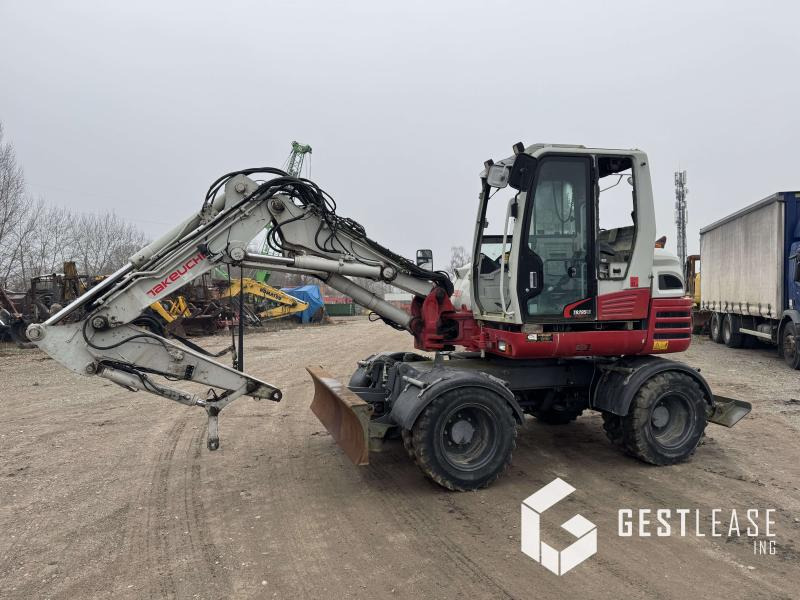 Takeuchi TB295W - Колёсный экскаватор: фото 1 Takeuchi TB295W - Колёсный экскаватор: фото 1