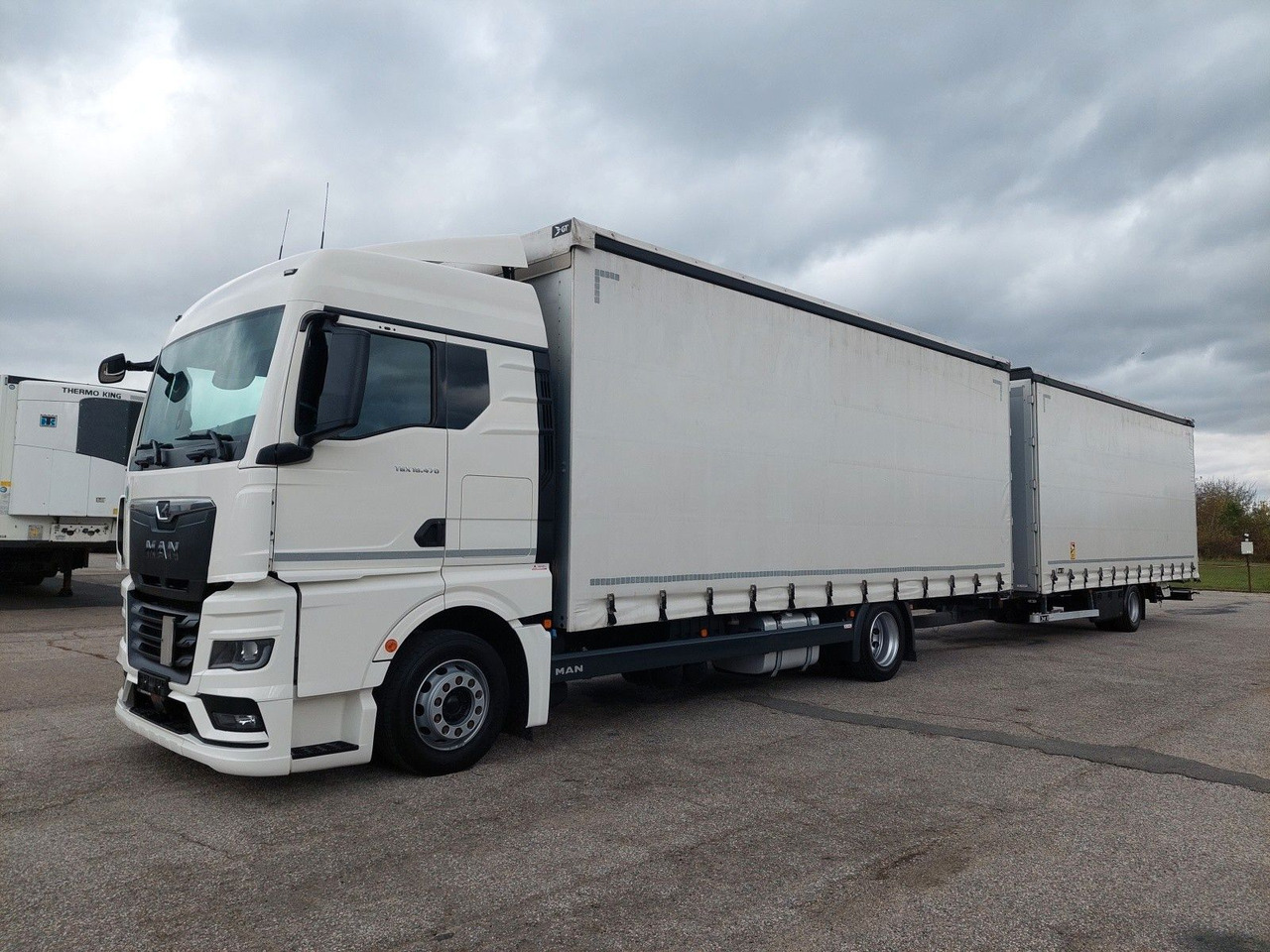 MAN TGX 18.470 LL + Gniotpol G-4080 120 m3 Durchbar - Тентованный грузовик: фото 1 MAN TGX 18.470 LL + Gniotpol G-4080 120 m3 Durchbar - Тентованный грузовик: фото 1