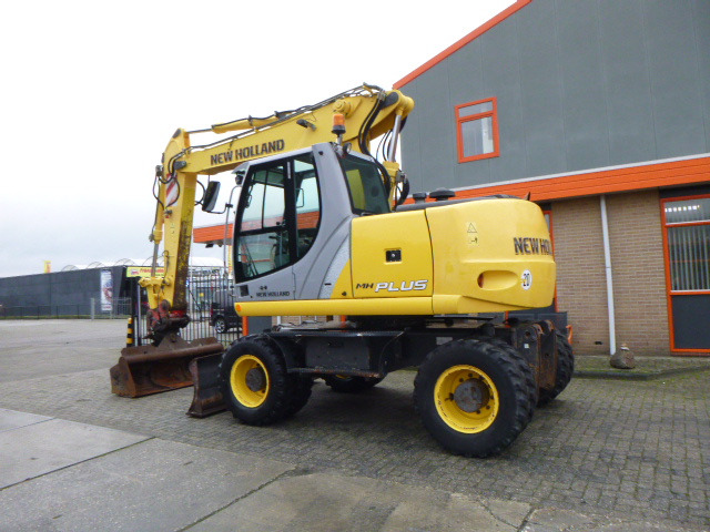 NEW HOLLAND MH PLUS - Колёсный экскаватор: фото 3 NEW HOLLAND MH PLUS - Колёсный экскаватор: фото 3