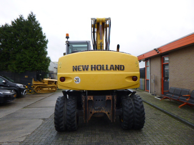 NEW HOLLAND MH PLUS - Колёсный экскаватор: фото 4 NEW HOLLAND MH PLUS - Колёсный экскаватор: фото 4