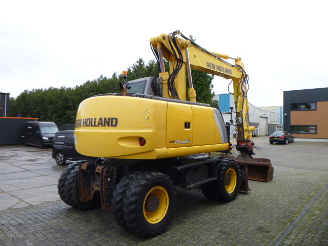 NEW HOLLAND MH PLUS - Колёсный экскаватор: фото 5 NEW HOLLAND MH PLUS - Колёсный экскаватор: фото 5