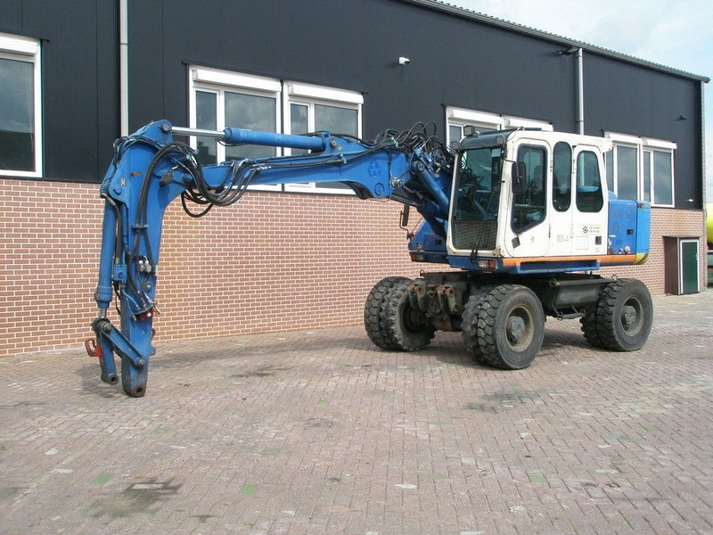 Atlas 1404 - Колёсный экскаватор: фото 1 Atlas 1404 - Колёсный экскаватор: фото 1