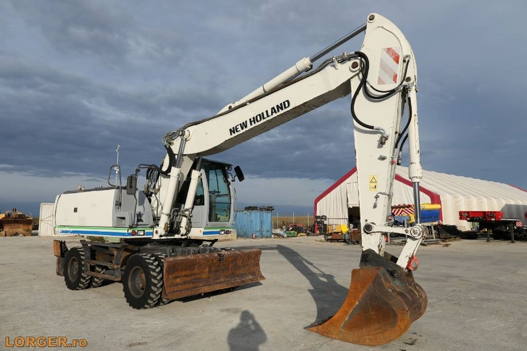 New Holland MH 6.6 + Sandvic Hammer - Колёсный экскаватор: фото 5 New Holland MH 6.6 + Sandvic Hammer - Колёсный экскаватор: фото 5