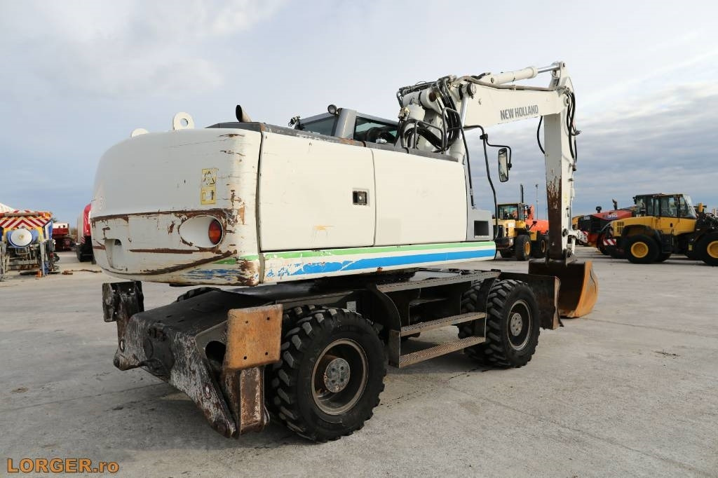 New Holland MH 6.6 + Sandvic Hammer - Колёсный экскаватор: фото 4 New Holland MH 6.6 + Sandvic Hammer - Колёсный экскаватор: фото 4