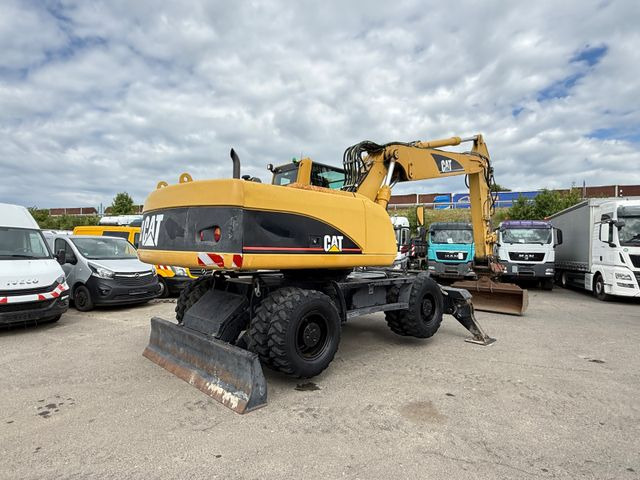 Колёсный экскаватор CAT M 322C: фото 6