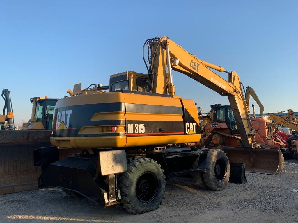 Колёсный экскаватор CAT M 315: фото 7