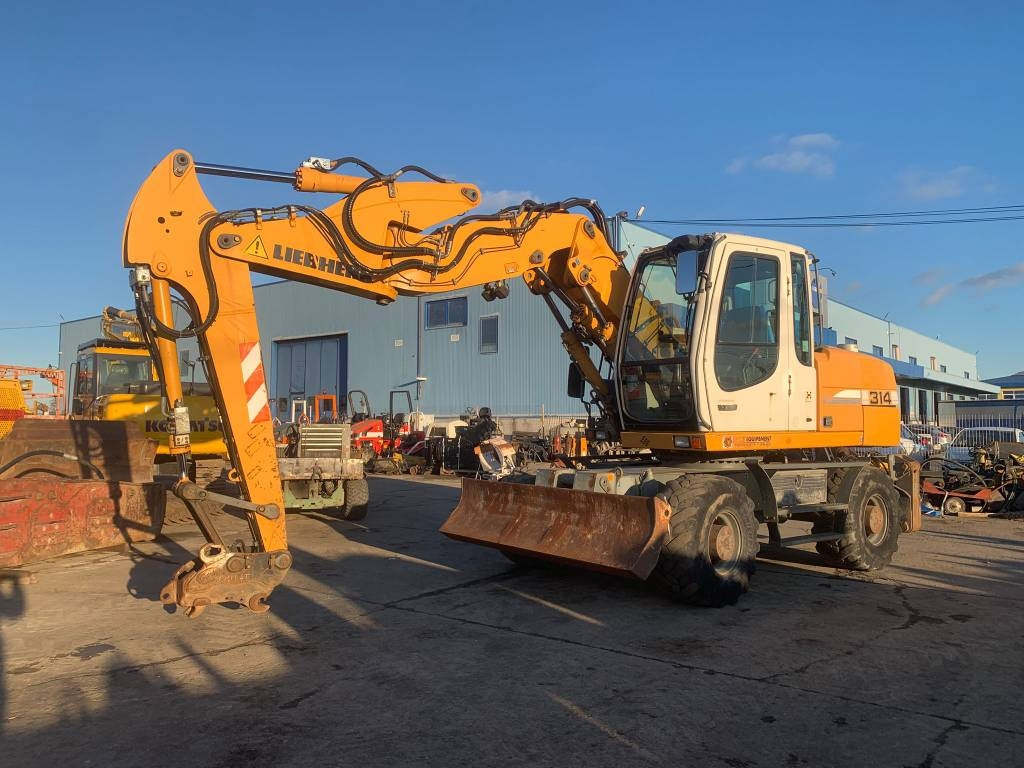 Liebherr A 314 Litronic - Колёсный экскаватор: фото 1 Liebherr A 314 Litronic - Колёсный экскаватор: фото 1