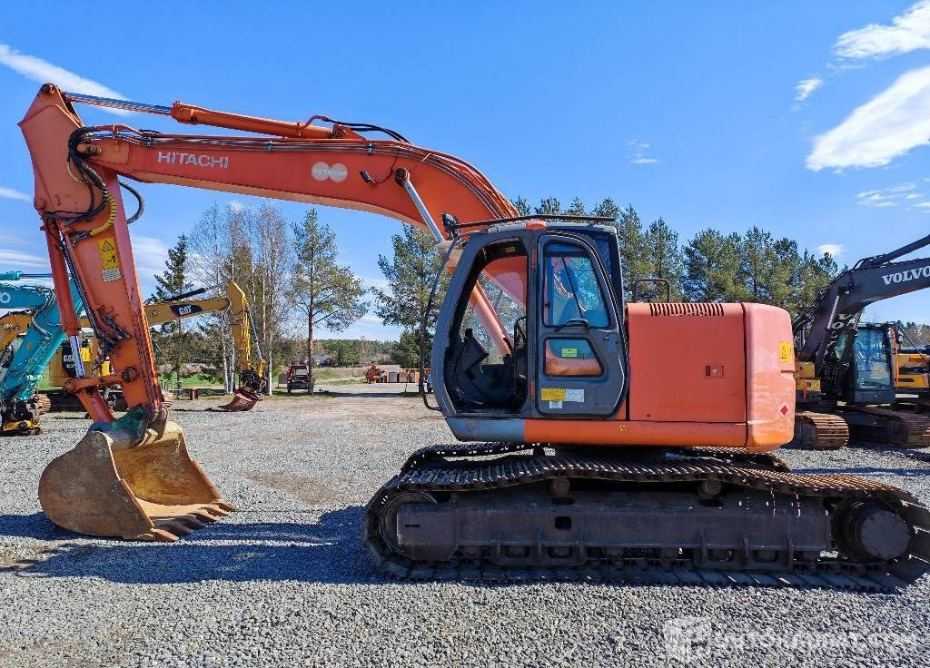 Hitachi ZX 225 US, 2003, 16 156 h Kaivinkone, Kurikka - Гусеничный экскаватор: фото 1 Hitachi ZX 225 US, 2003, 16 156 h Kaivinkone, Kurikka - Гусеничный экскаватор: фото 1