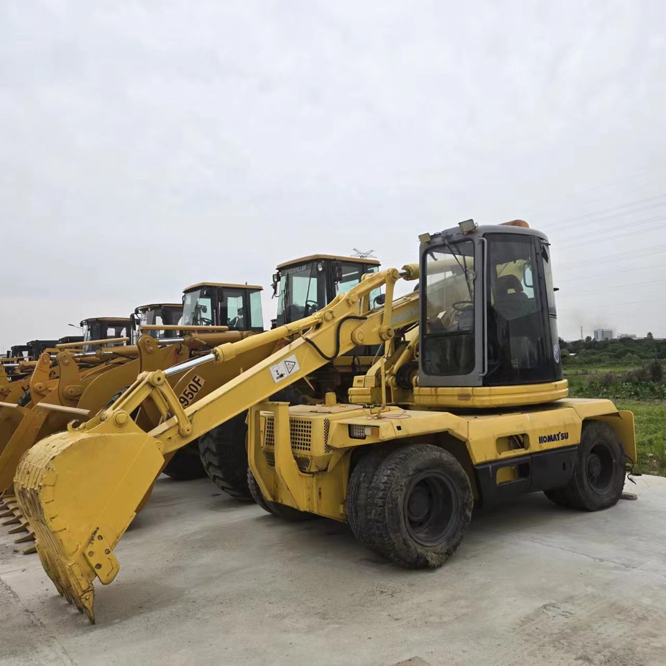 KOMATSU PC128US - Колёсный экскаватор: фото 1 KOMATSU PC128US - Колёсный экскаватор: фото 1