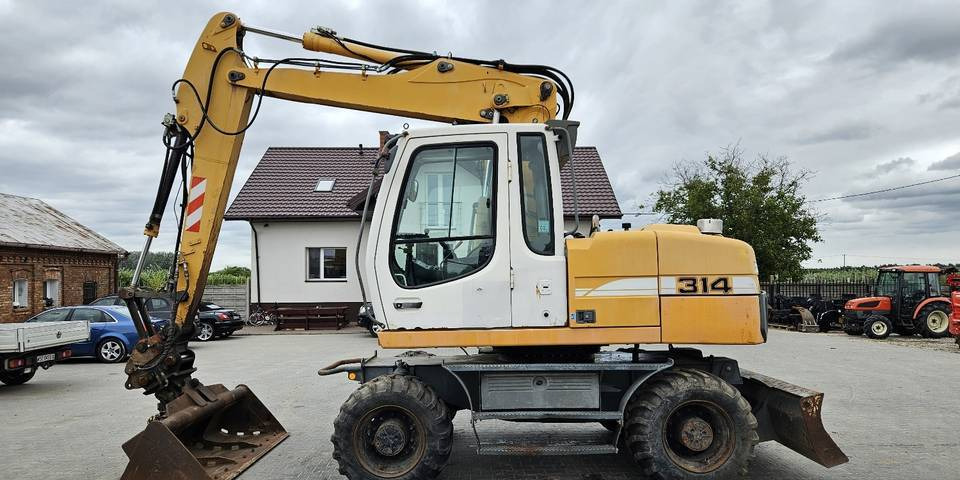 Koparka kołowa Liebherr A314 Litronic 9350 h 4 łyżki kołówka - Колёсный экскаватор: фото 1 Koparka kołowa Liebherr A314 Litronic 9350 h 4 łyżki kołówka - Колёсный экскаватор: фото 1