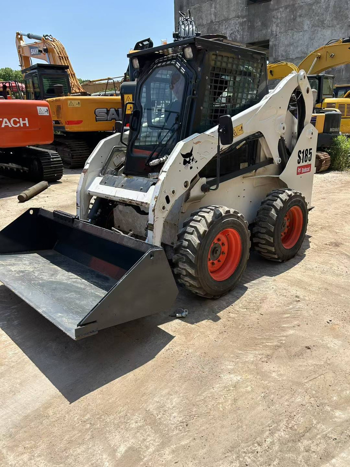 BOBCAT Skid Steer Loader S185 - Мини-погрузчик с бортовым поворотом: фото 1 BOBCAT Skid Steer Loader S185 - Мини-погрузчик с бортовым поворотом: фото 1