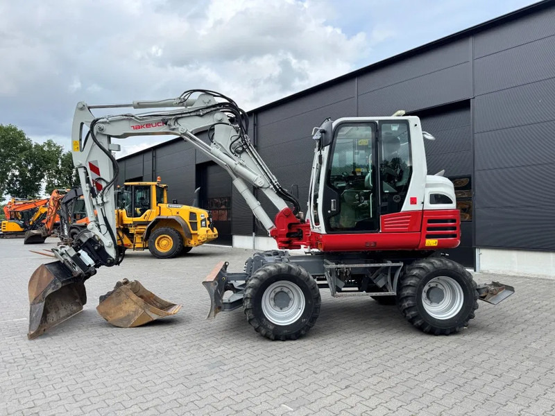 Takeuchi TB295W BJ 2021 3500 uur Compacttilt Draaikantelstuk met Gripper ! - Колёсный экскаватор: фото 1 Takeuchi TB295W BJ 2021 3500 uur Compacttilt Draaikantelstuk met Gripper ! - Колёсный экскаватор: фото 1