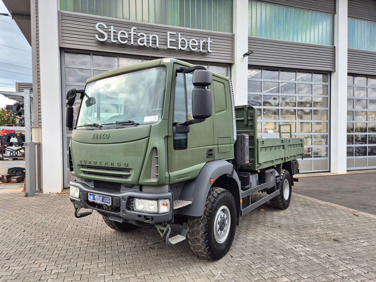 Iveco Eurocargo ML100E22WM-BW 4x4 Pritsche L-Haus Bett - Грузовик бортовой/ Платформа: фото 1 Iveco Eurocargo ML100E22WM-BW 4x4 Pritsche L-Haus Bett - Грузовик бортовой/ Платформа: фото 1