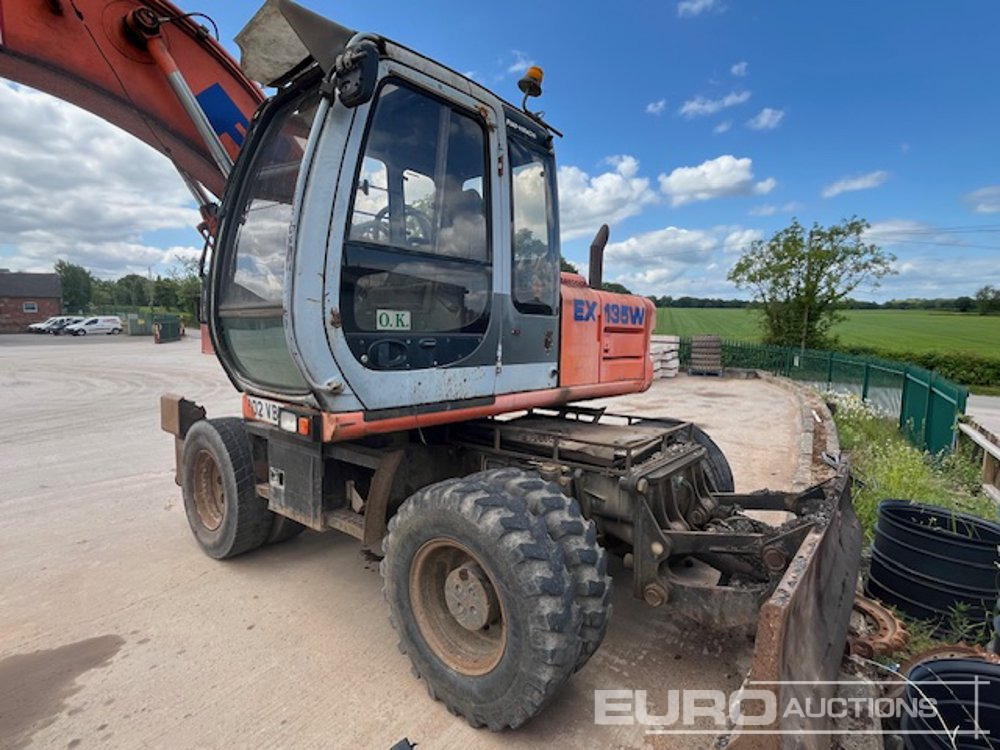 2002 Fiat Hitachi EX135W - Колёсный экскаватор: фото 1 2002 Fiat Hitachi EX135W - Колёсный экскаватор: фото 1